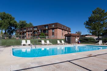 Outdoor, heated swimming pool with sundeck